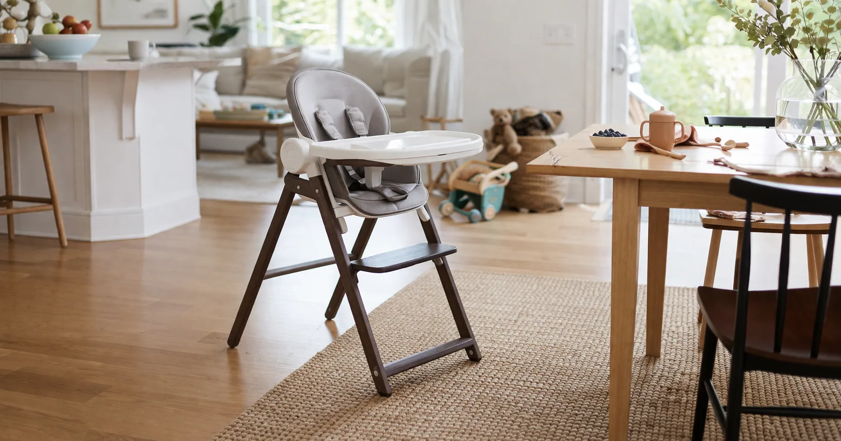 Several baby high chairs arranged in a bright dining area