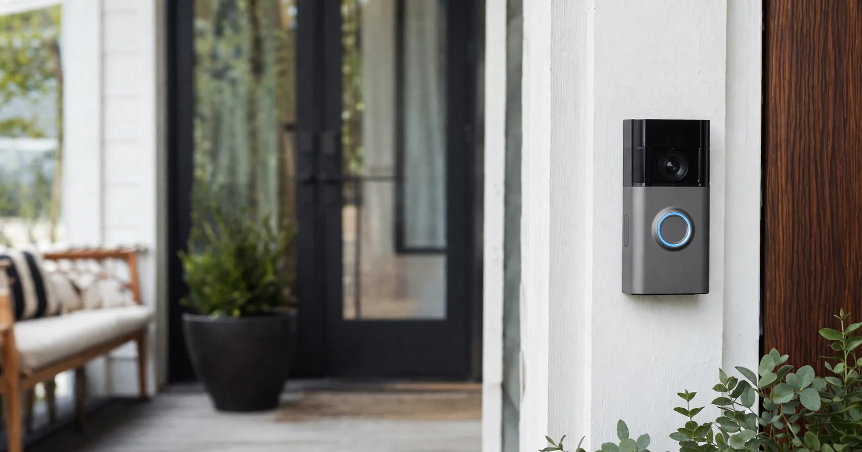 Ring video doorbell mounted beside a front door